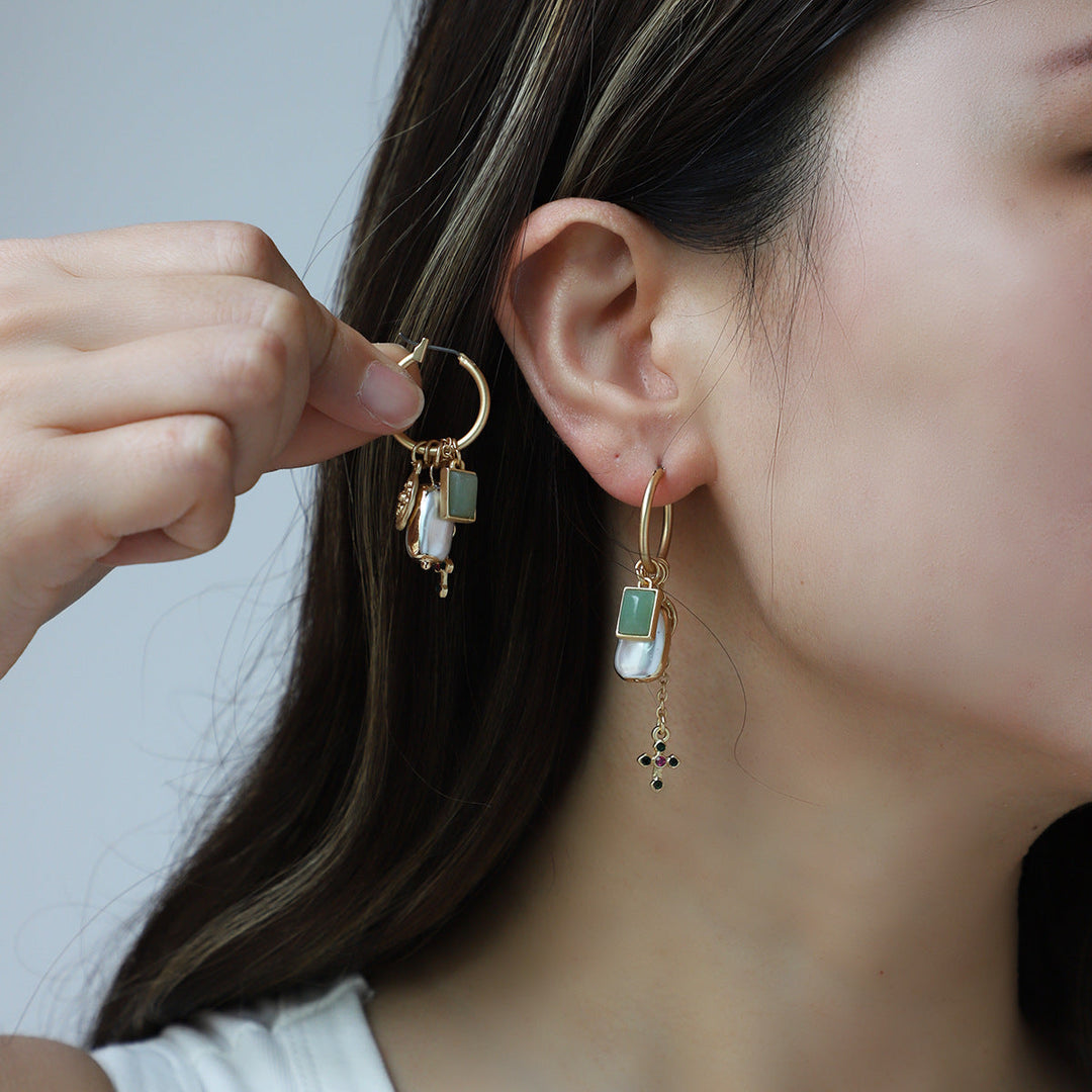 Different style pearl and gemstone earrings